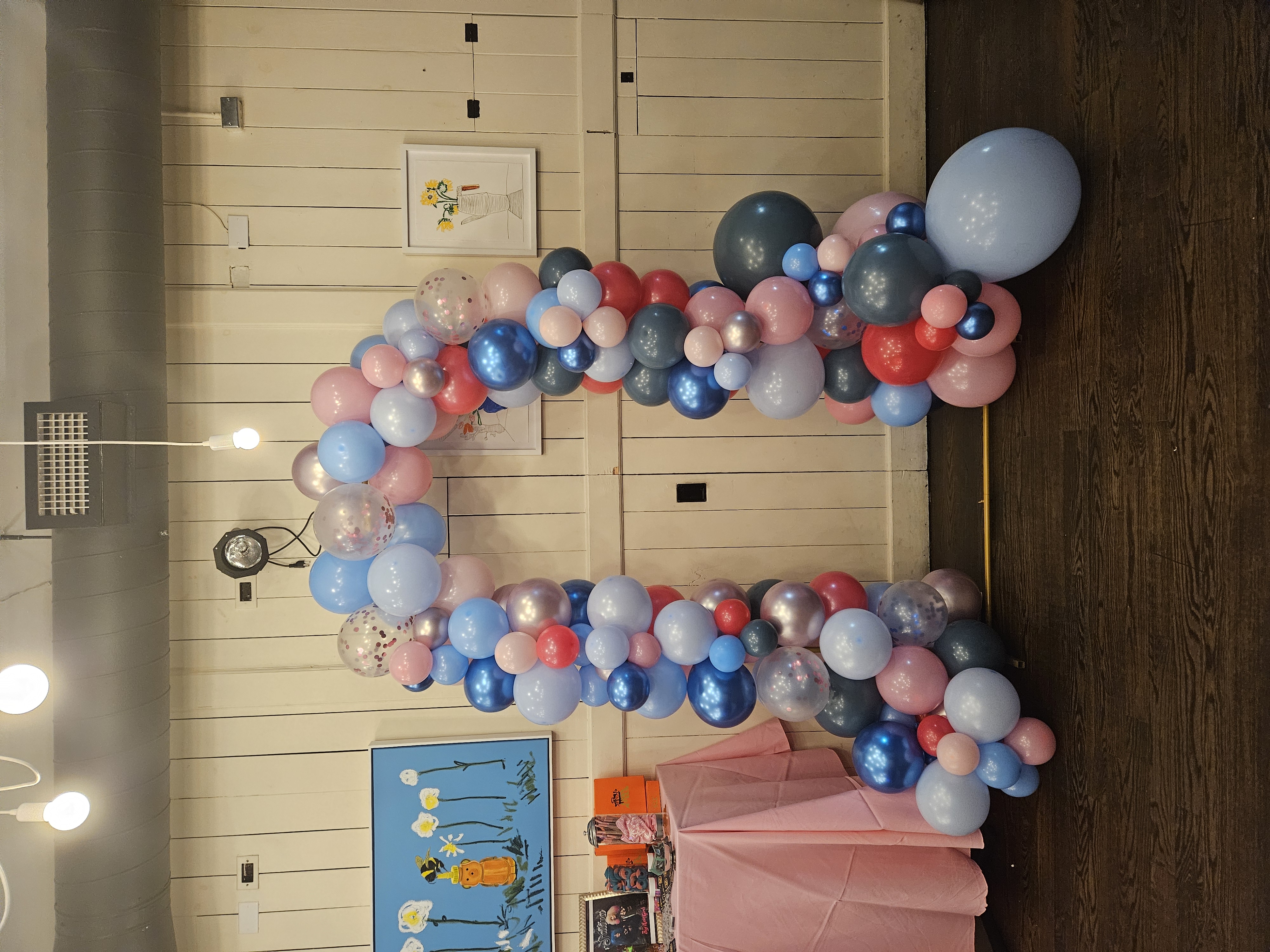 A multi-colored, 10 foot balloon arch for a baby shower