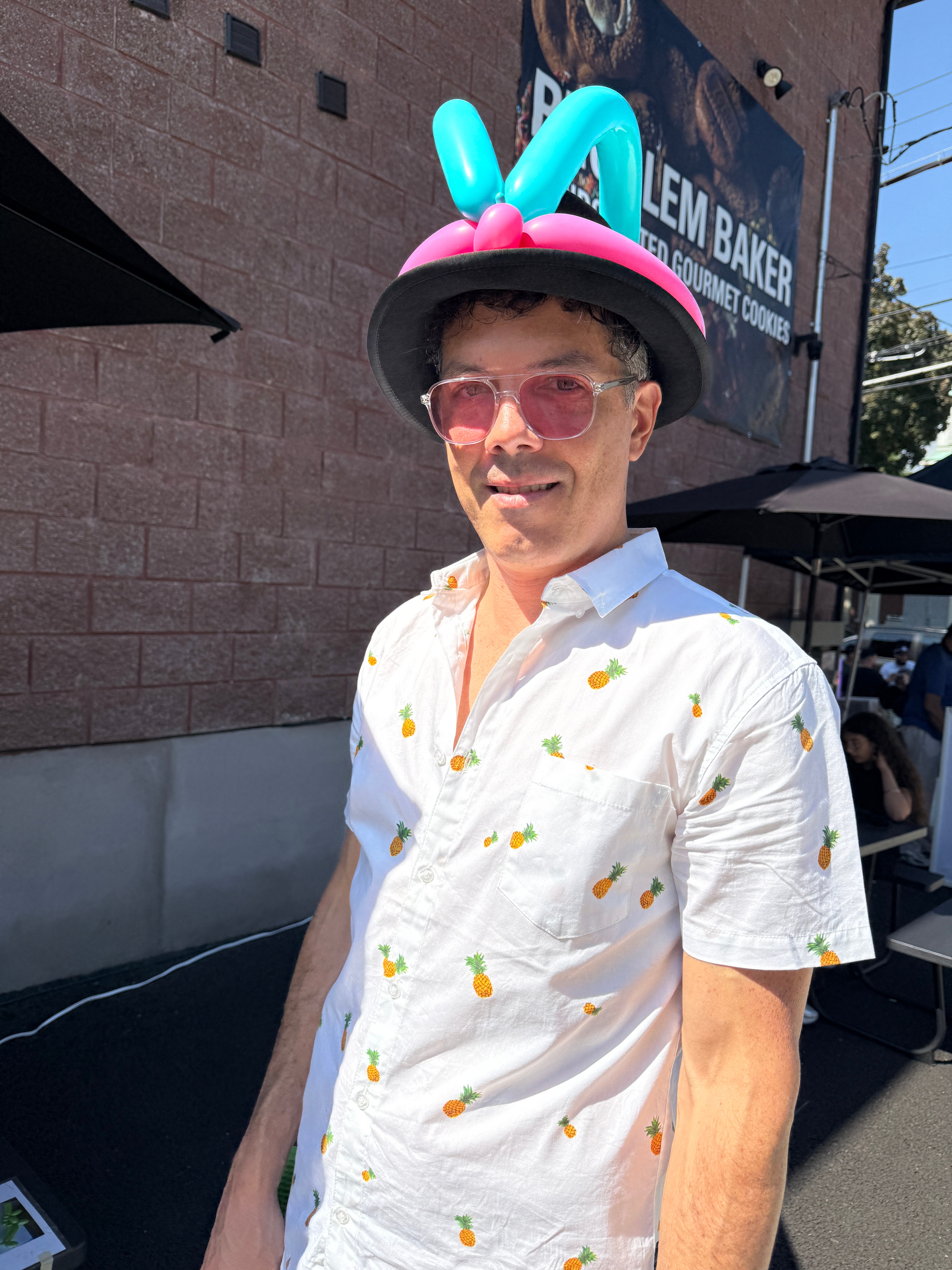 David John Steton, owner of Heart Light Balloons, with a balloon hat on