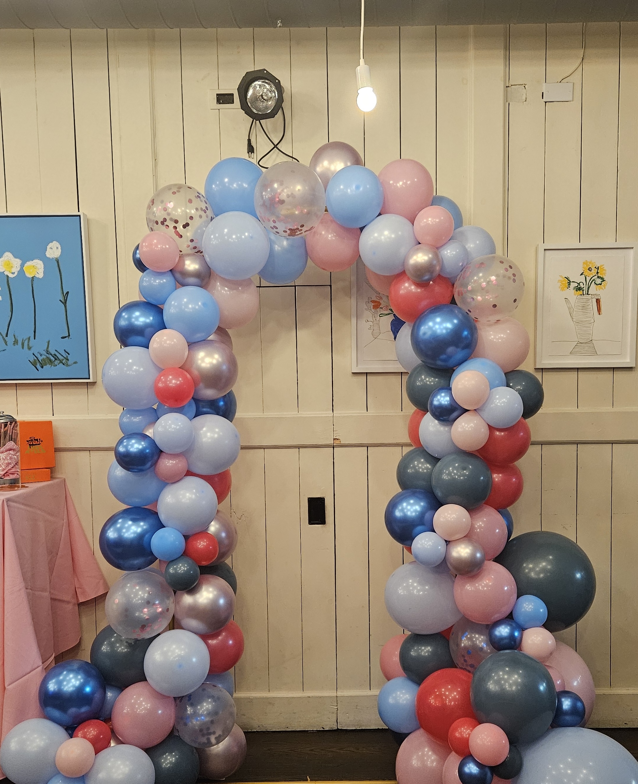 Modern balloon installation with flowing design for Queens event